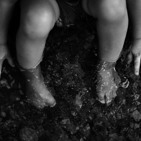 toddler-playing-in-the-creek-feet-and-hands-in-wat-2022-11-16-22-14-26-utc_2_gray.jpg